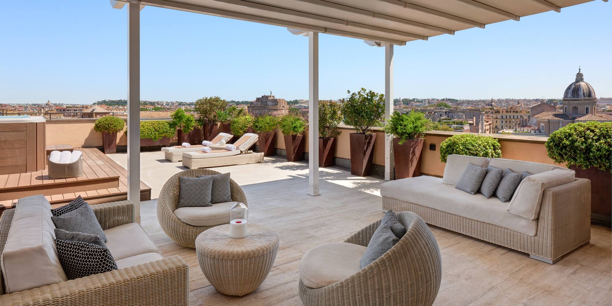 a patio with chairs and a table
