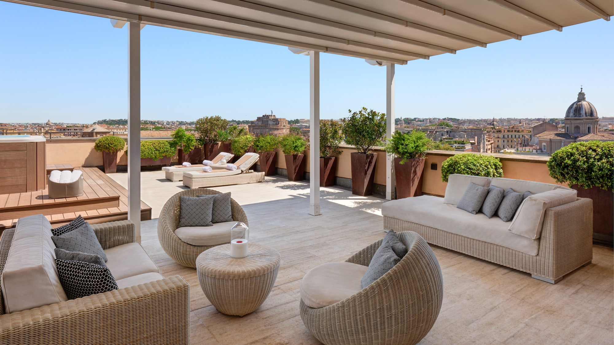 a patio with chairs and a table