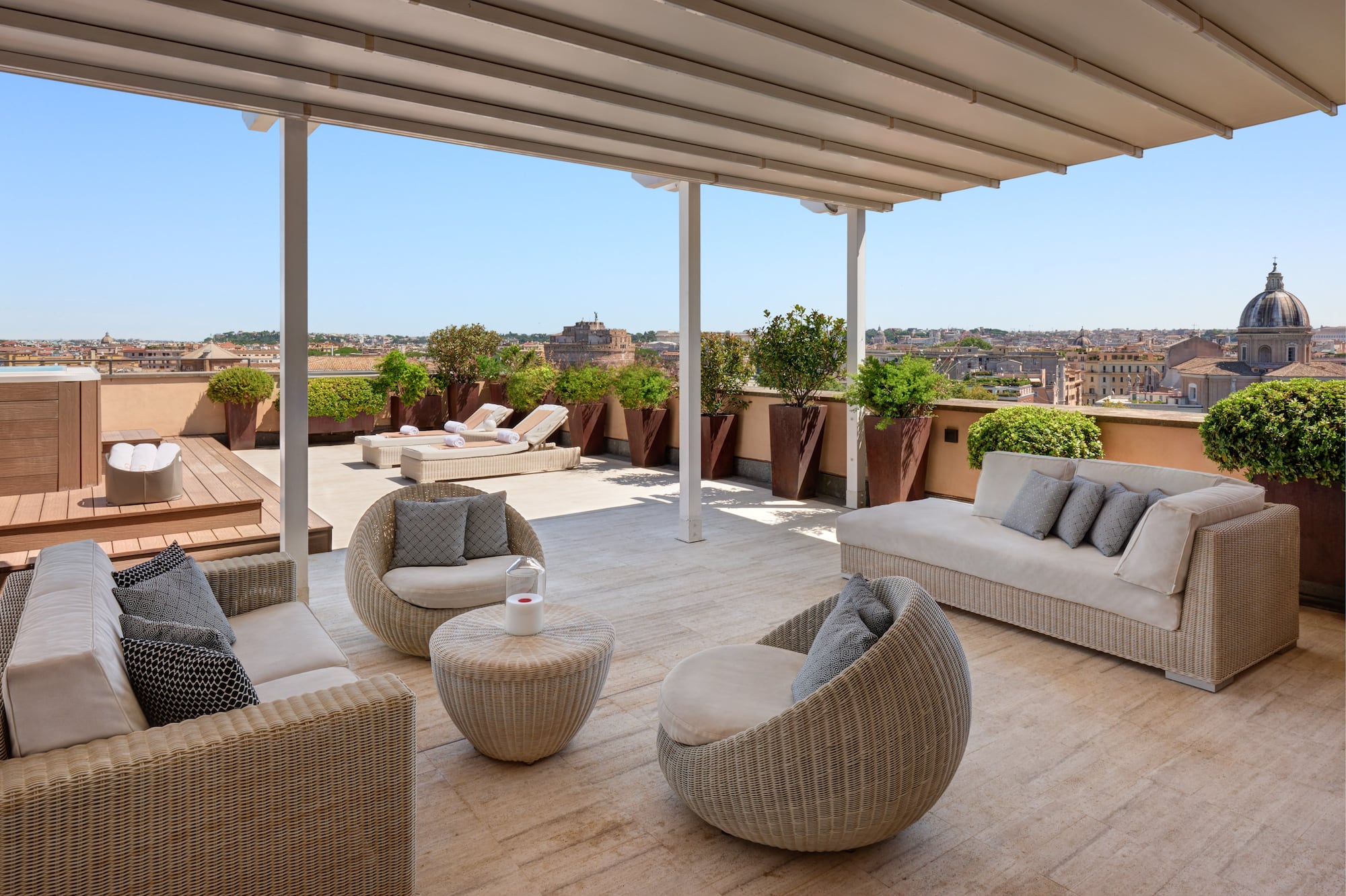 a patio with chairs and a table