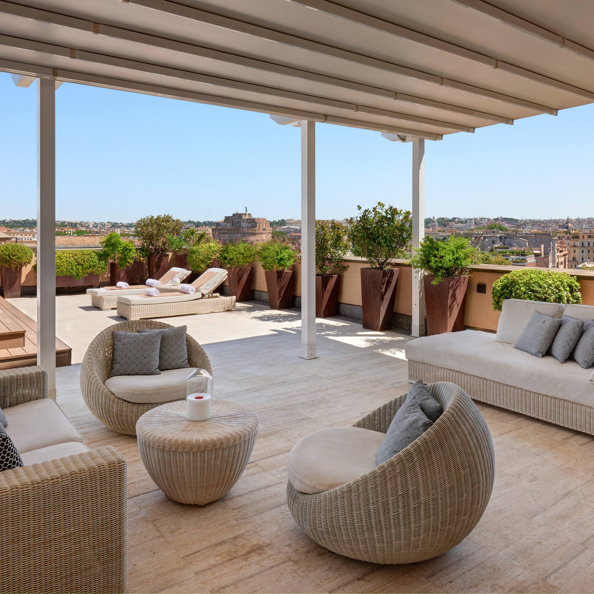 a patio with chairs and a table