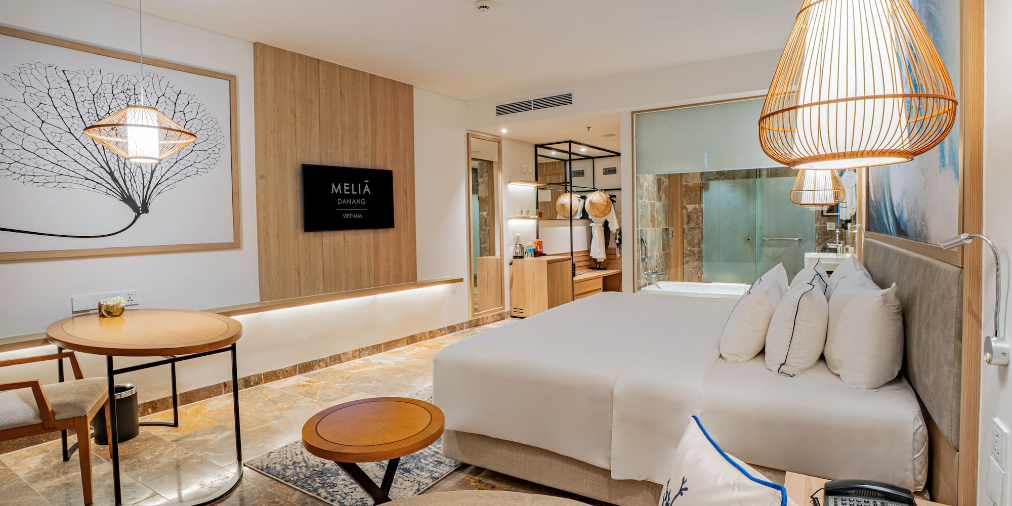 a room with a bed and a lamp