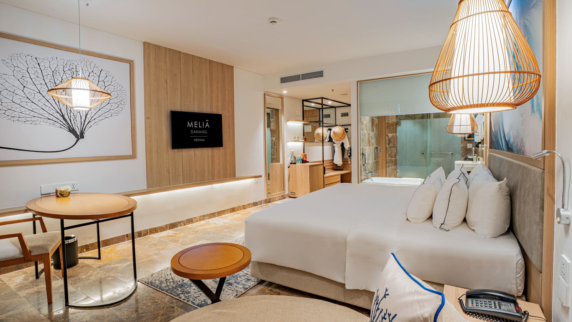 a room with a bed and a lamp