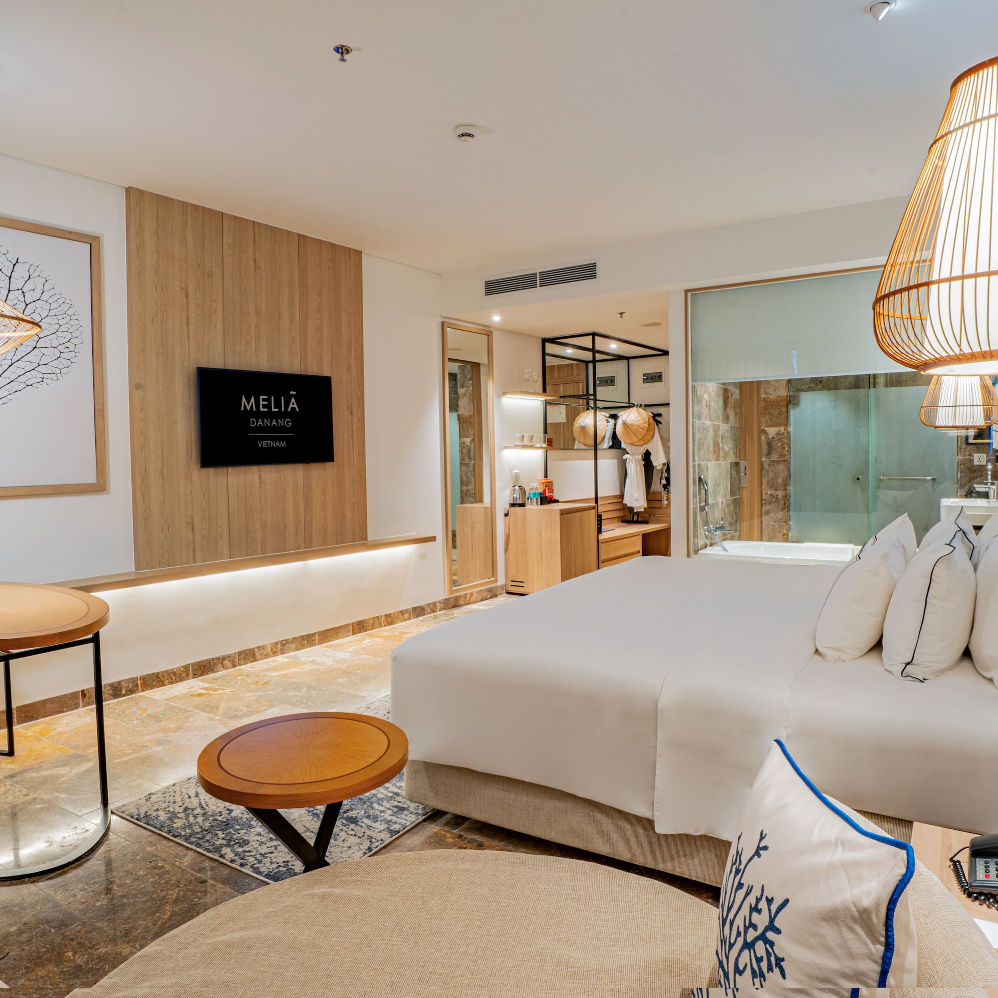 a room with a bed and a lamp