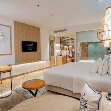 a room with a bed and a lamp