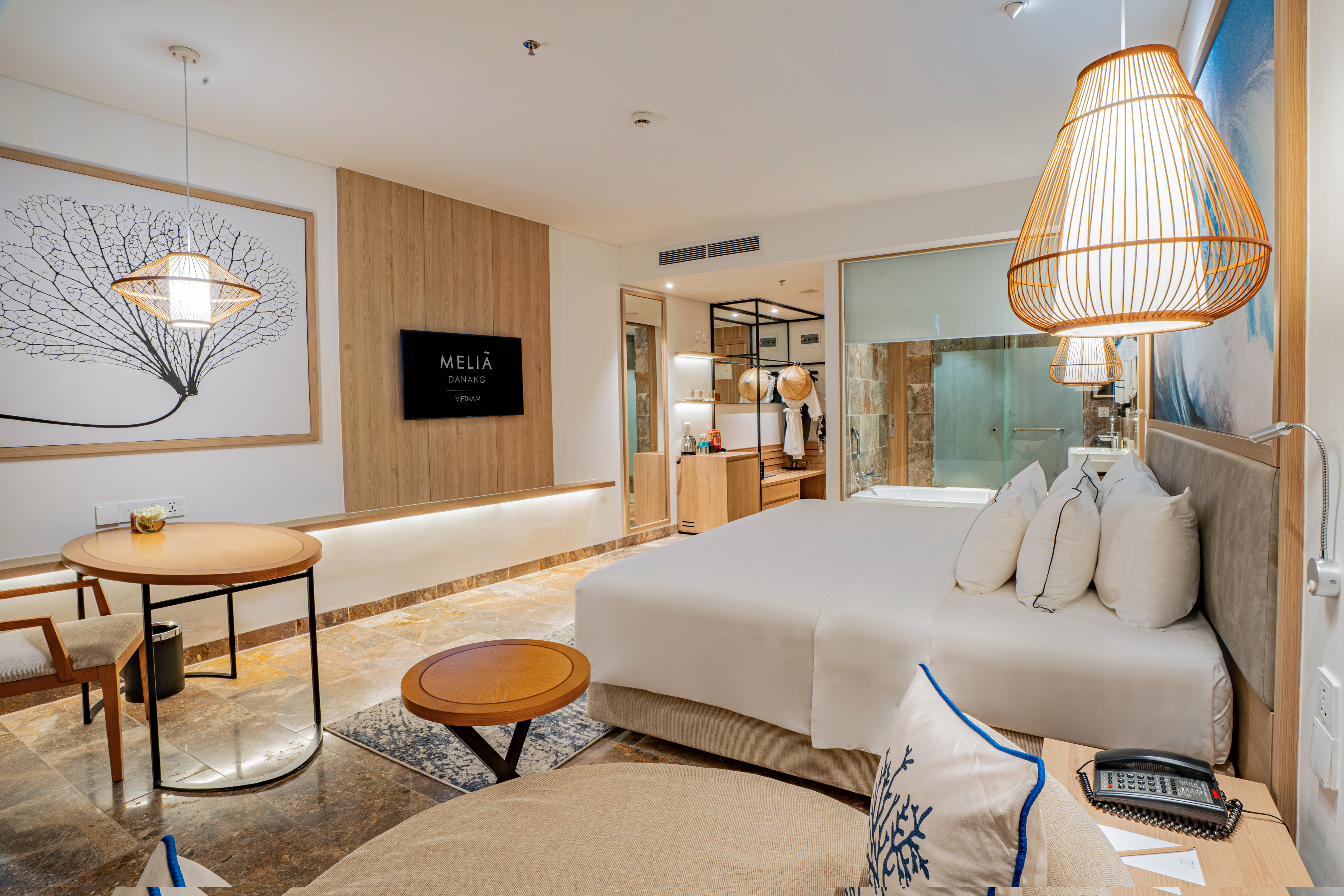 a room with a bed and a lamp