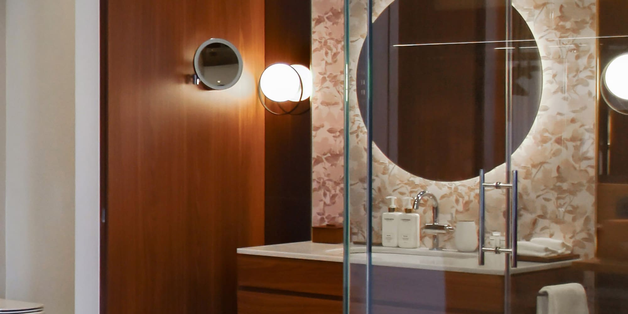 a bathroom with a glass shower door