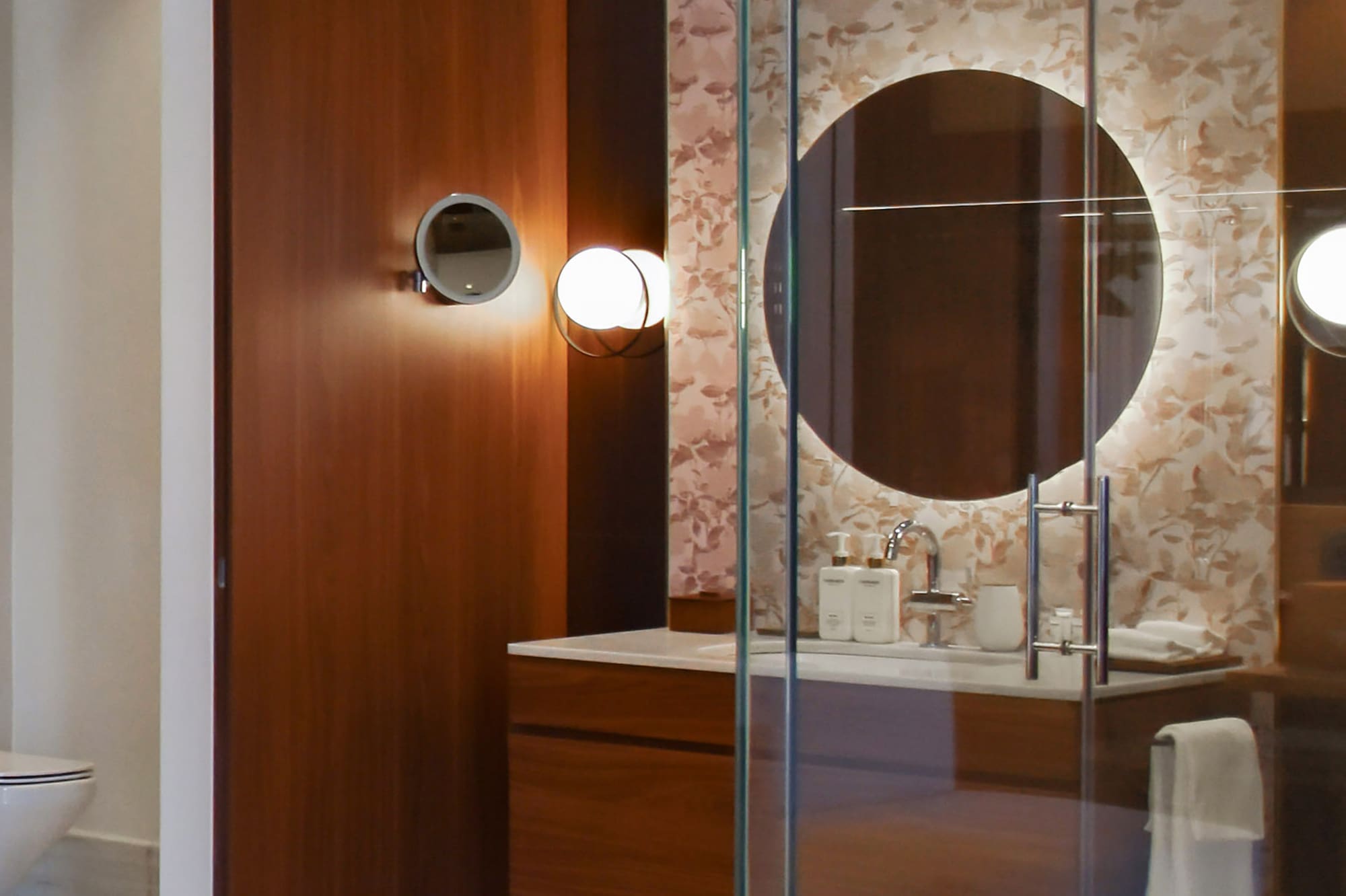 a bathroom with a glass shower door