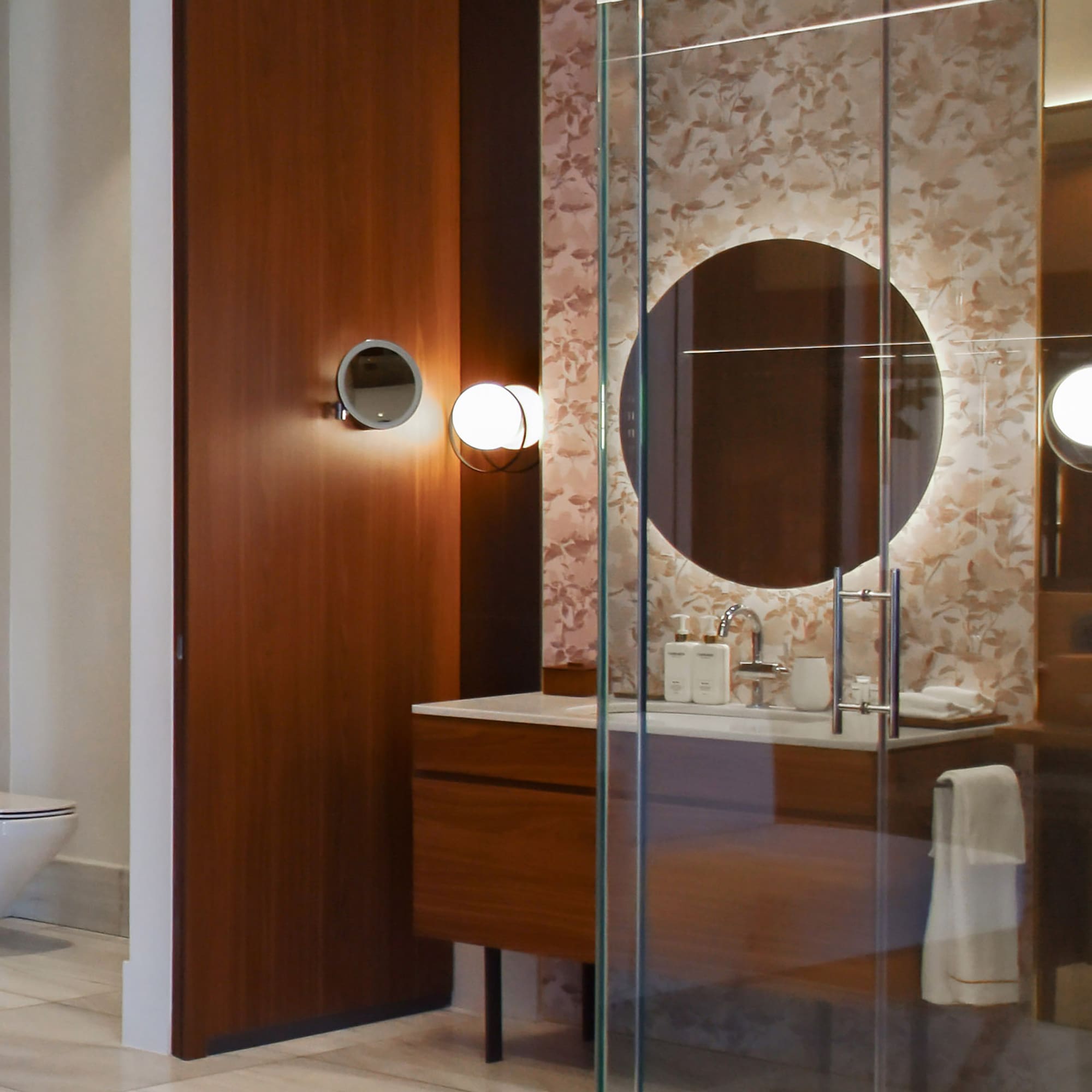 a bathroom with a glass shower door