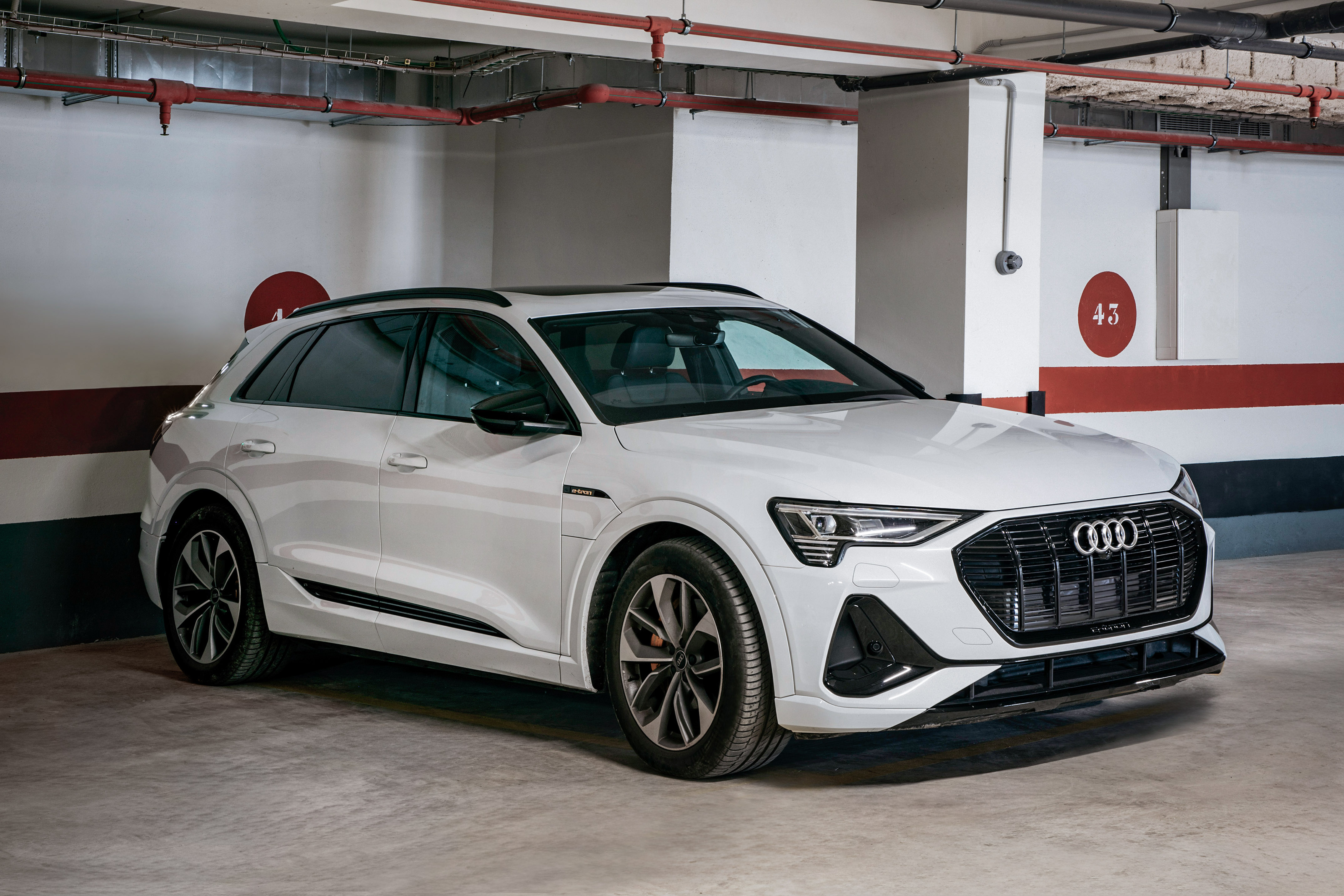 a white car parked in a parking lot