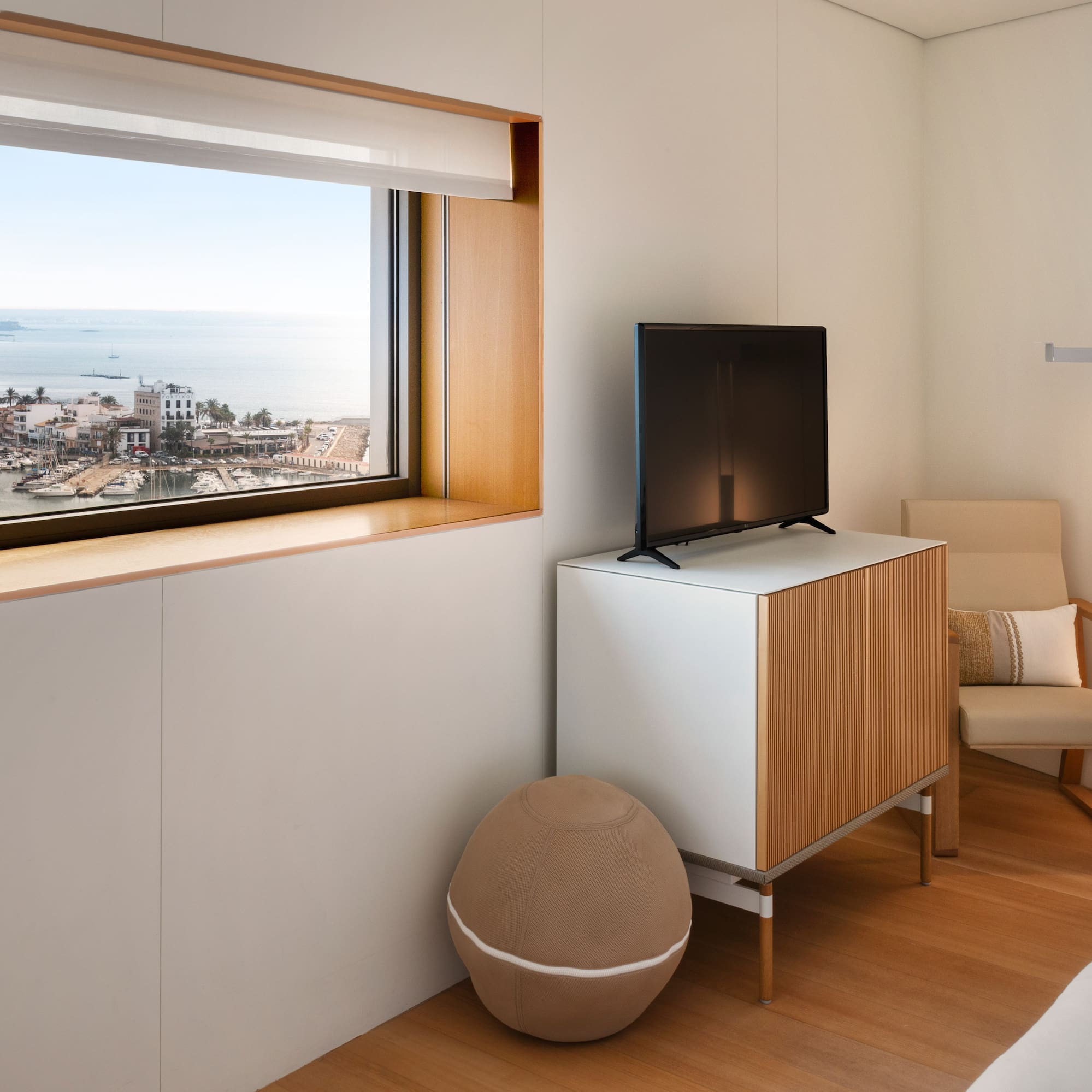 a room with a television and a chair