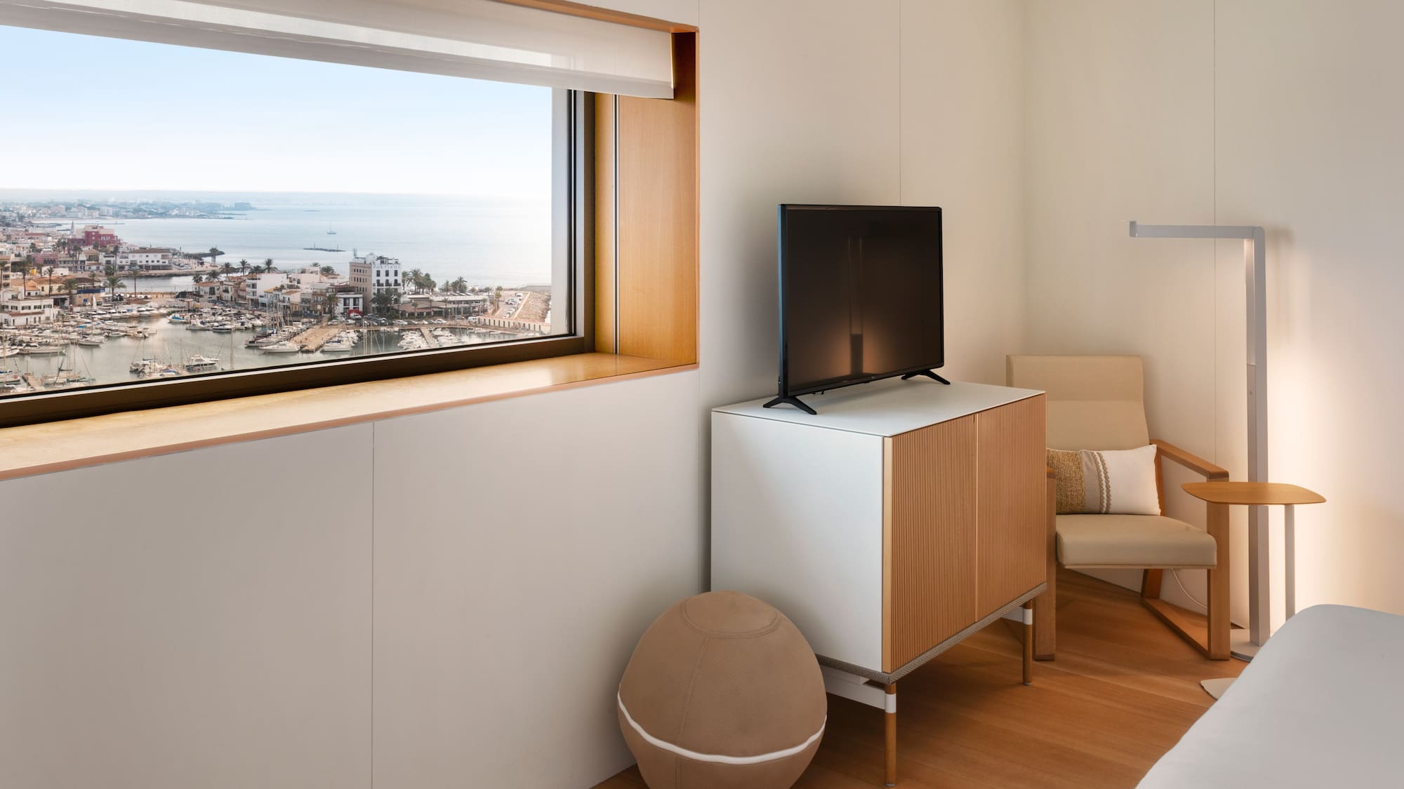 a room with a television and a chair