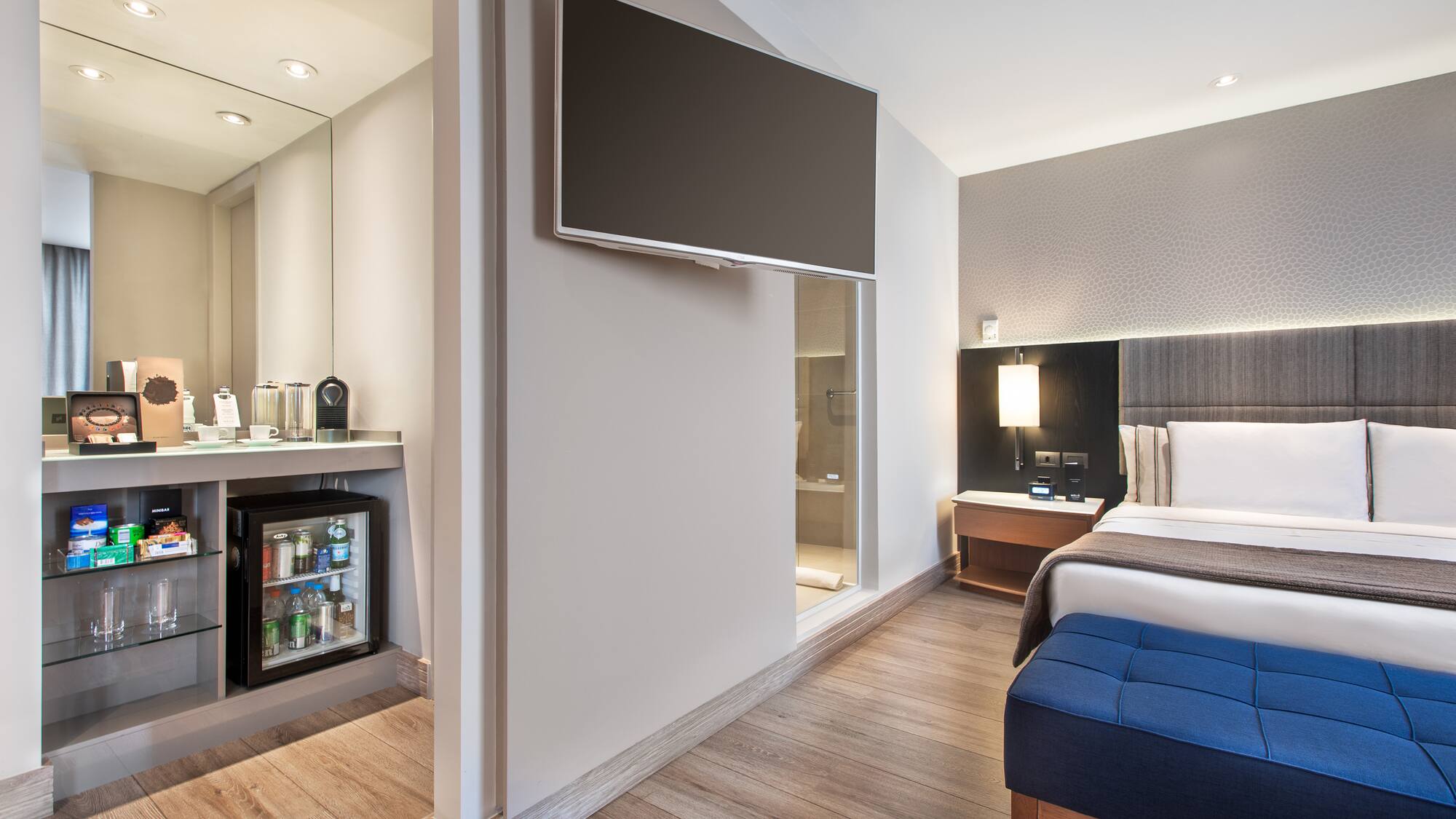 a room with a bed and a tv