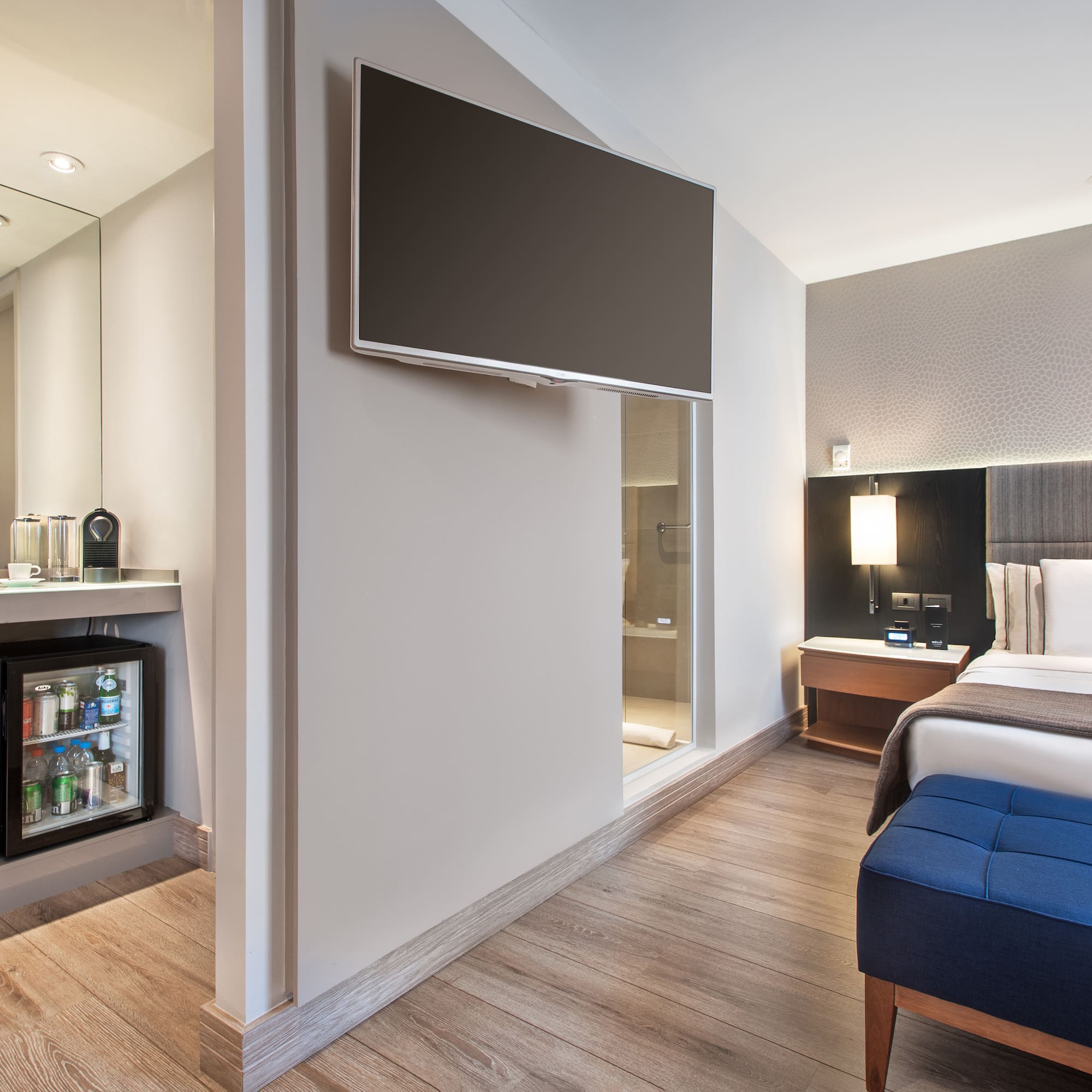 a room with a bed and a tv