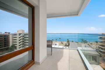 a balcony with a view of the ocean
