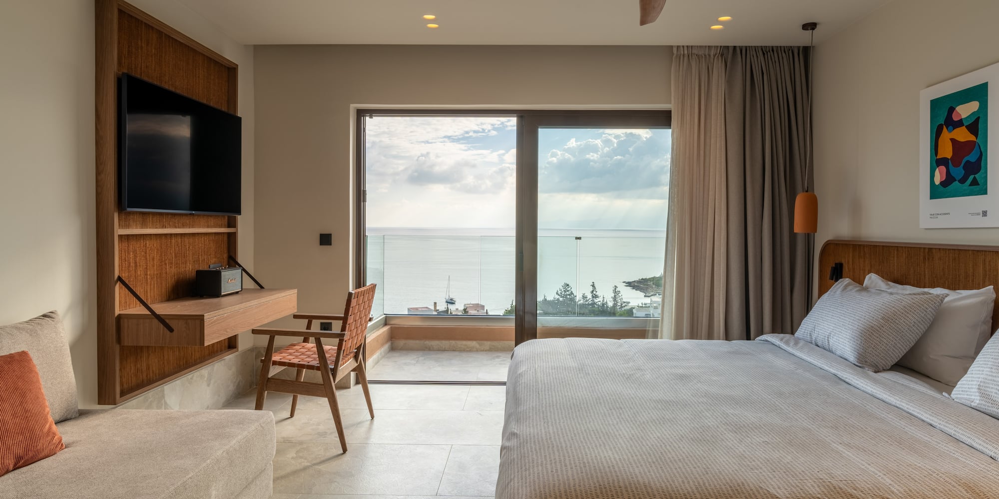 a bedroom with a large window and a bed