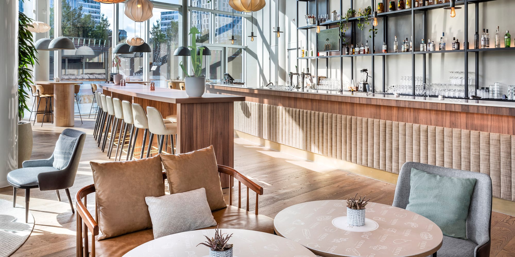 a room with a bar and tables