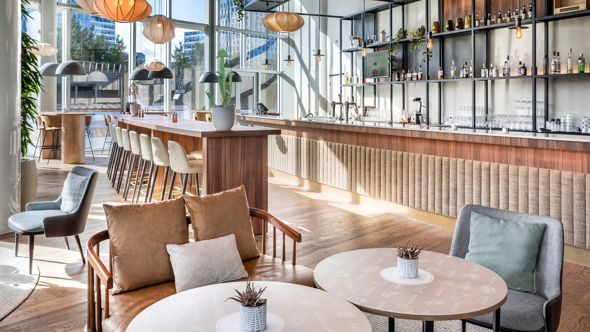 a room with a bar and tables