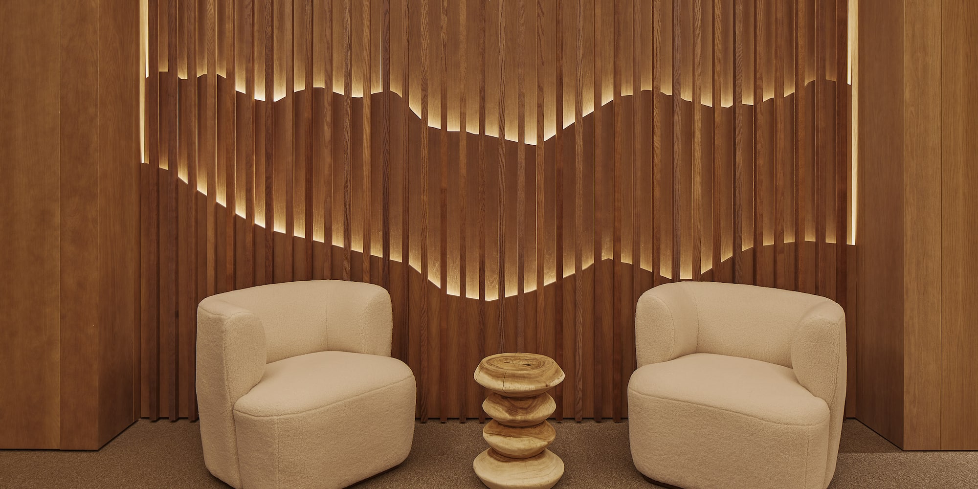 two chairs next to a table