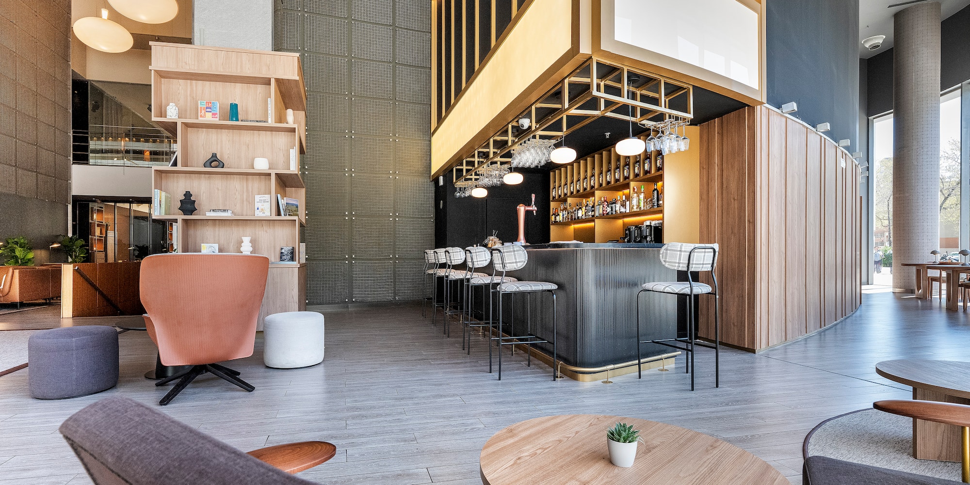 a room with a bar and chairs