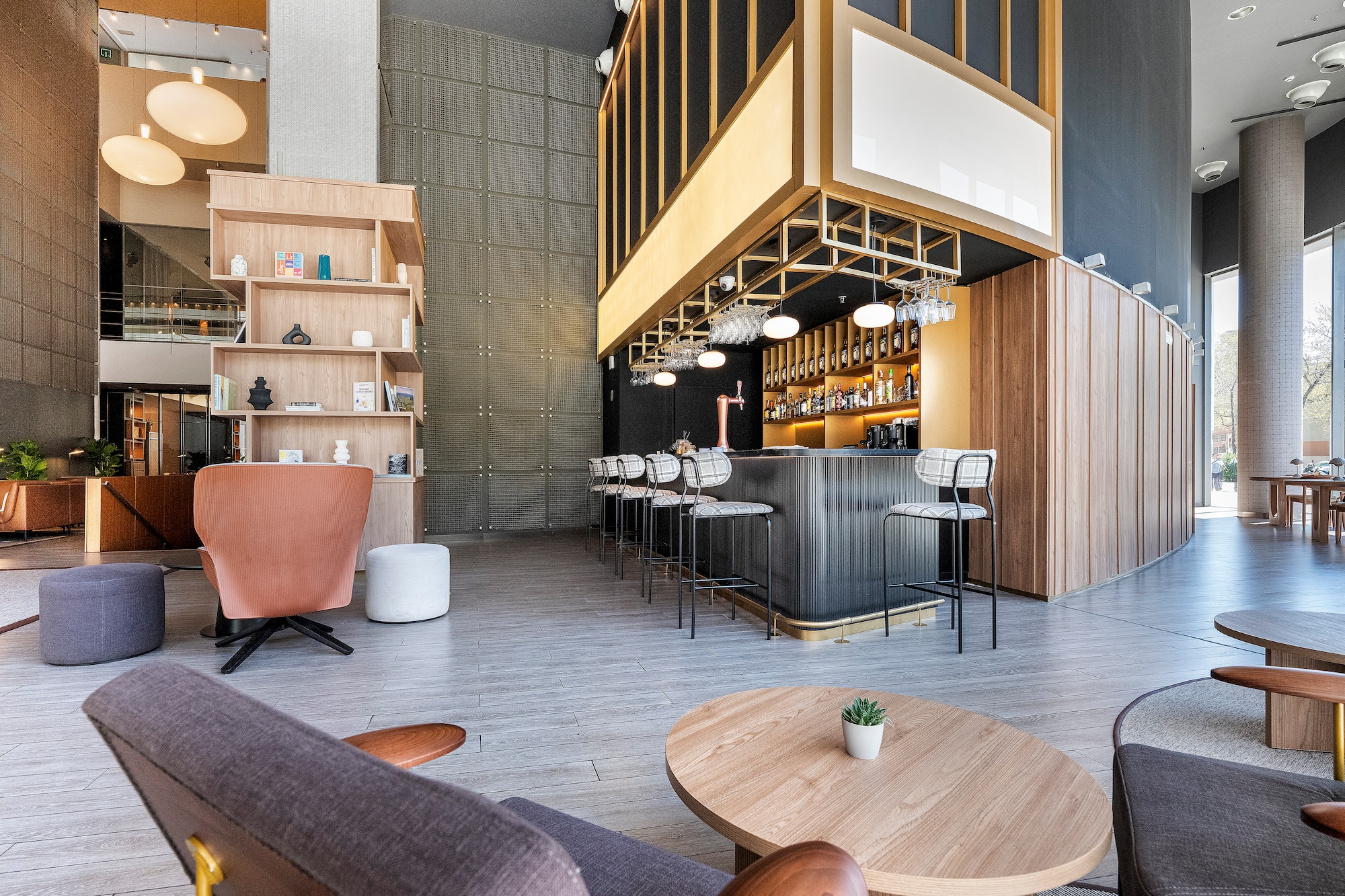 a room with a bar and chairs