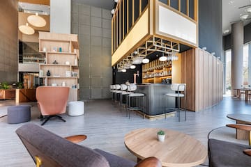 a room with a bar and chairs