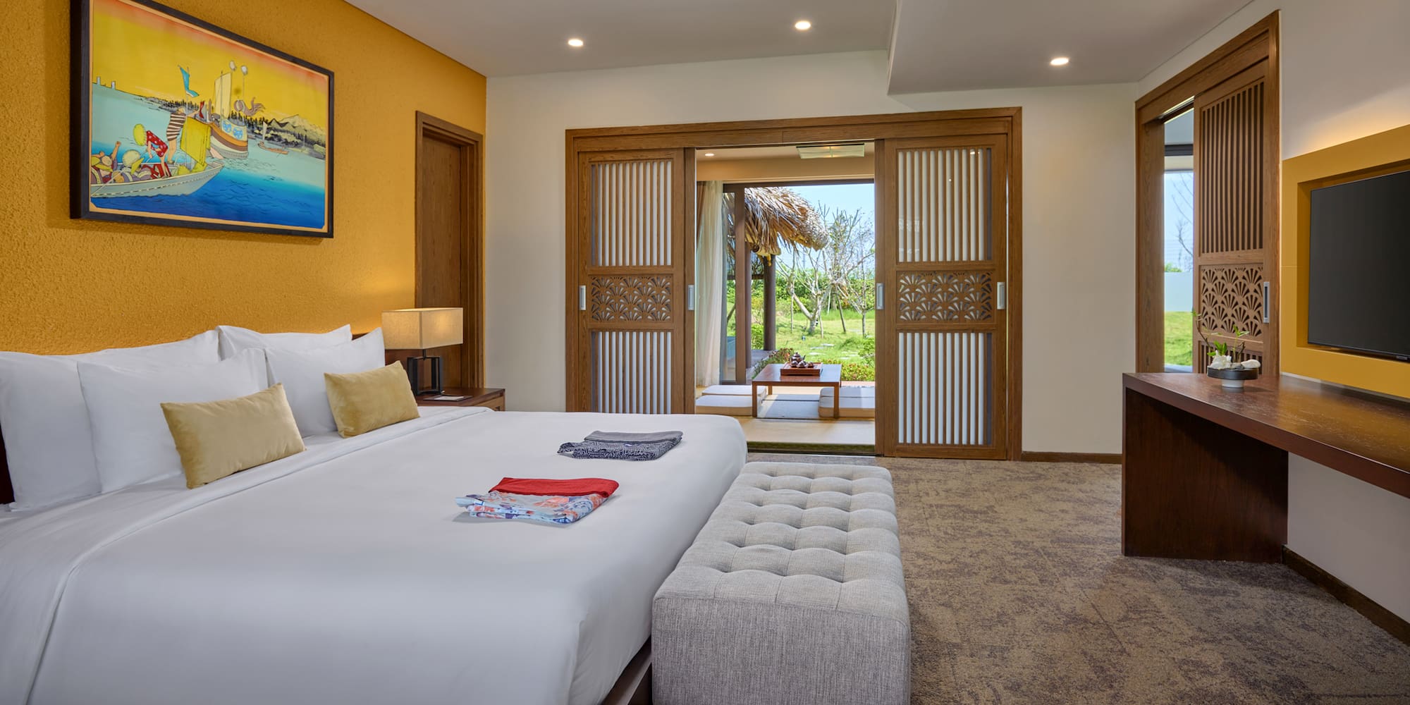 a bedroom with a bed and a table