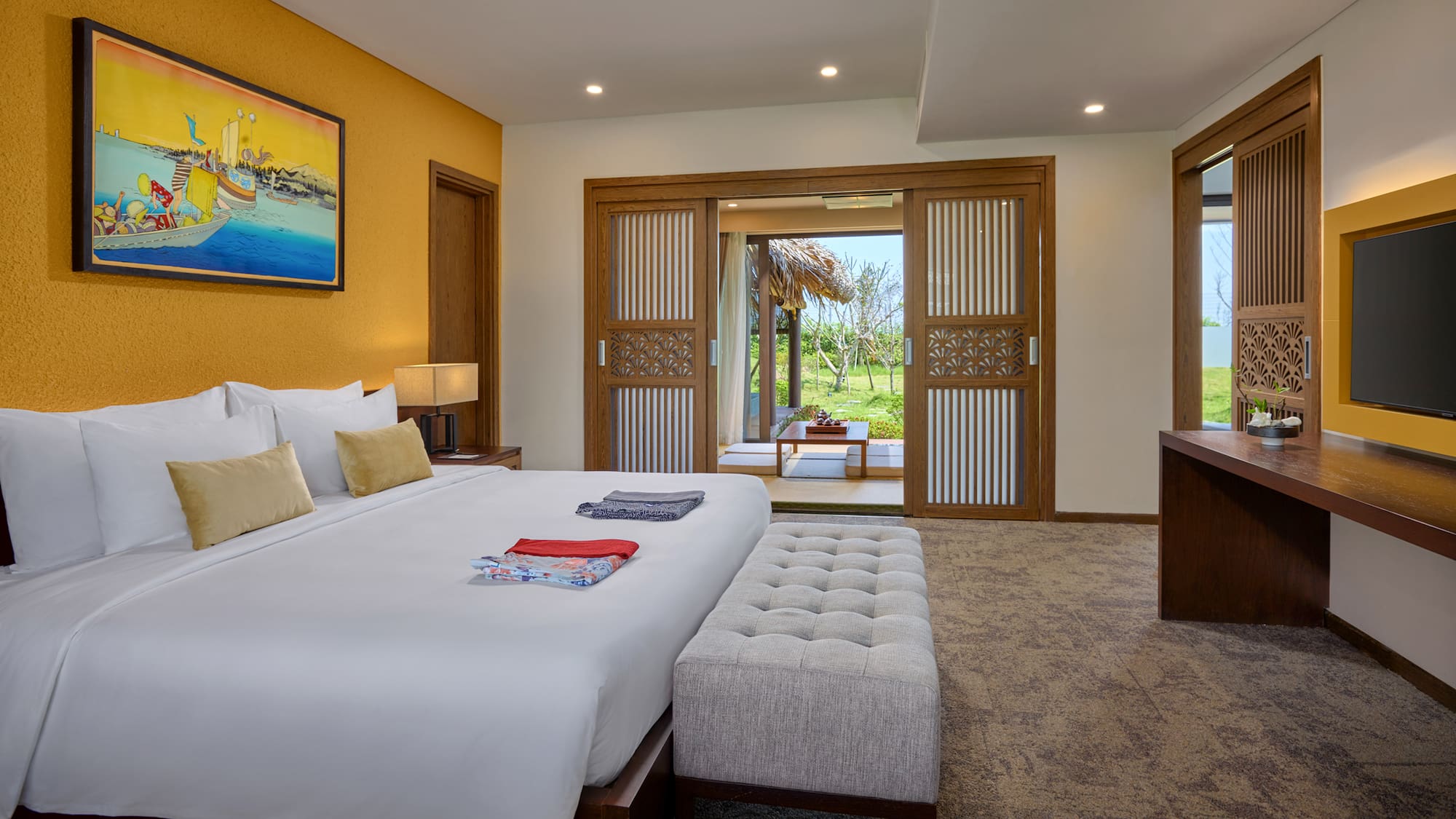 a bedroom with a bed and a table