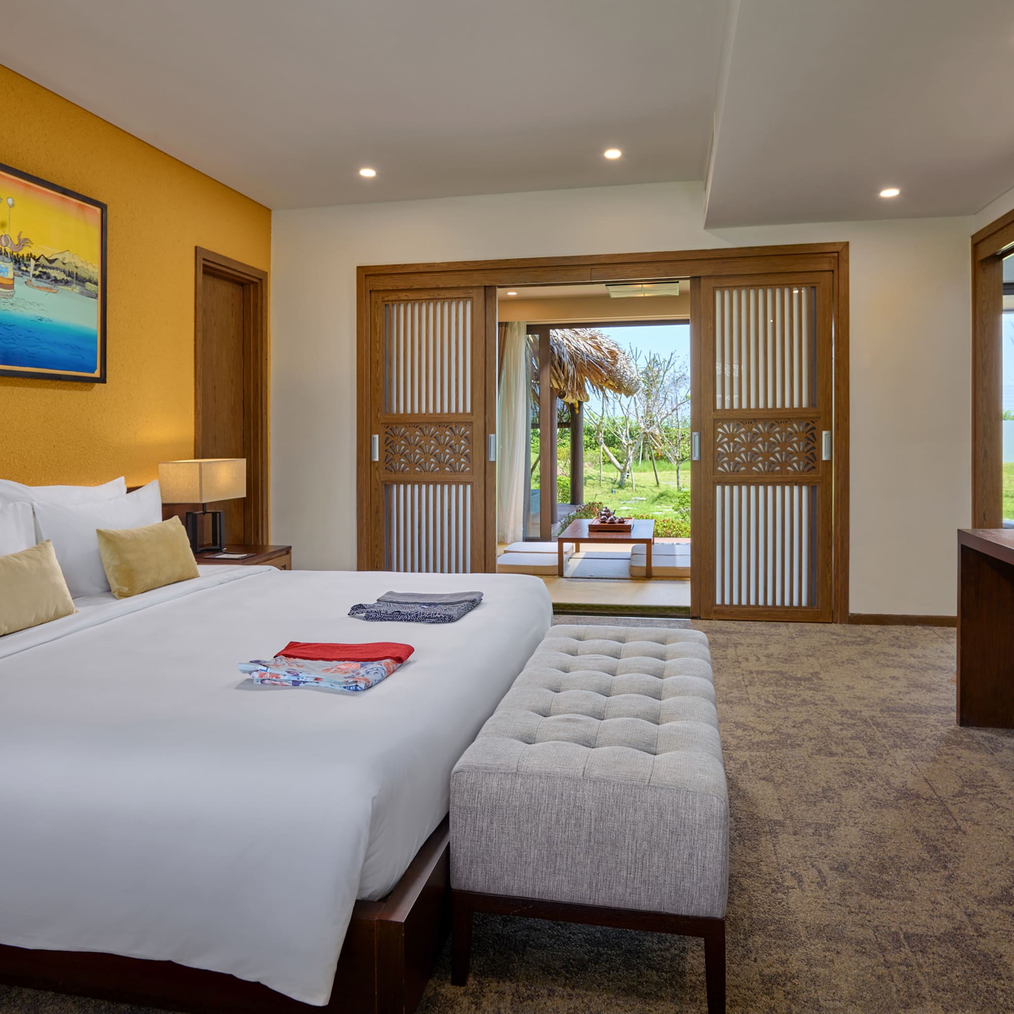 a bedroom with a bed and a table