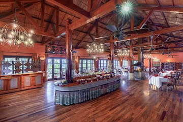 a large room with a large table and a ceiling fan