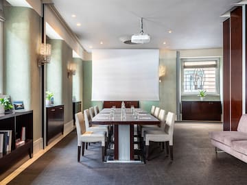 a room with a table and chairs