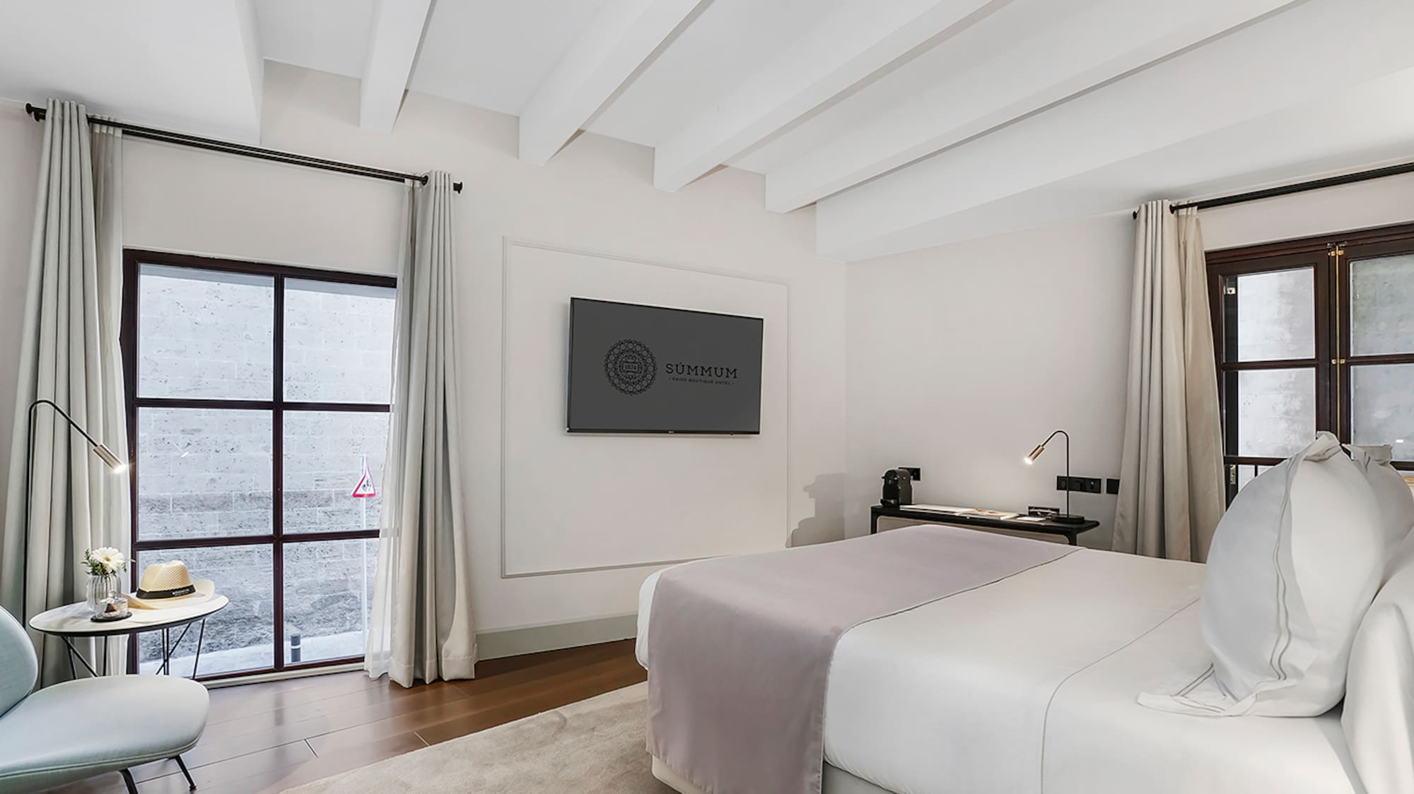 a bedroom with a bed and a tv