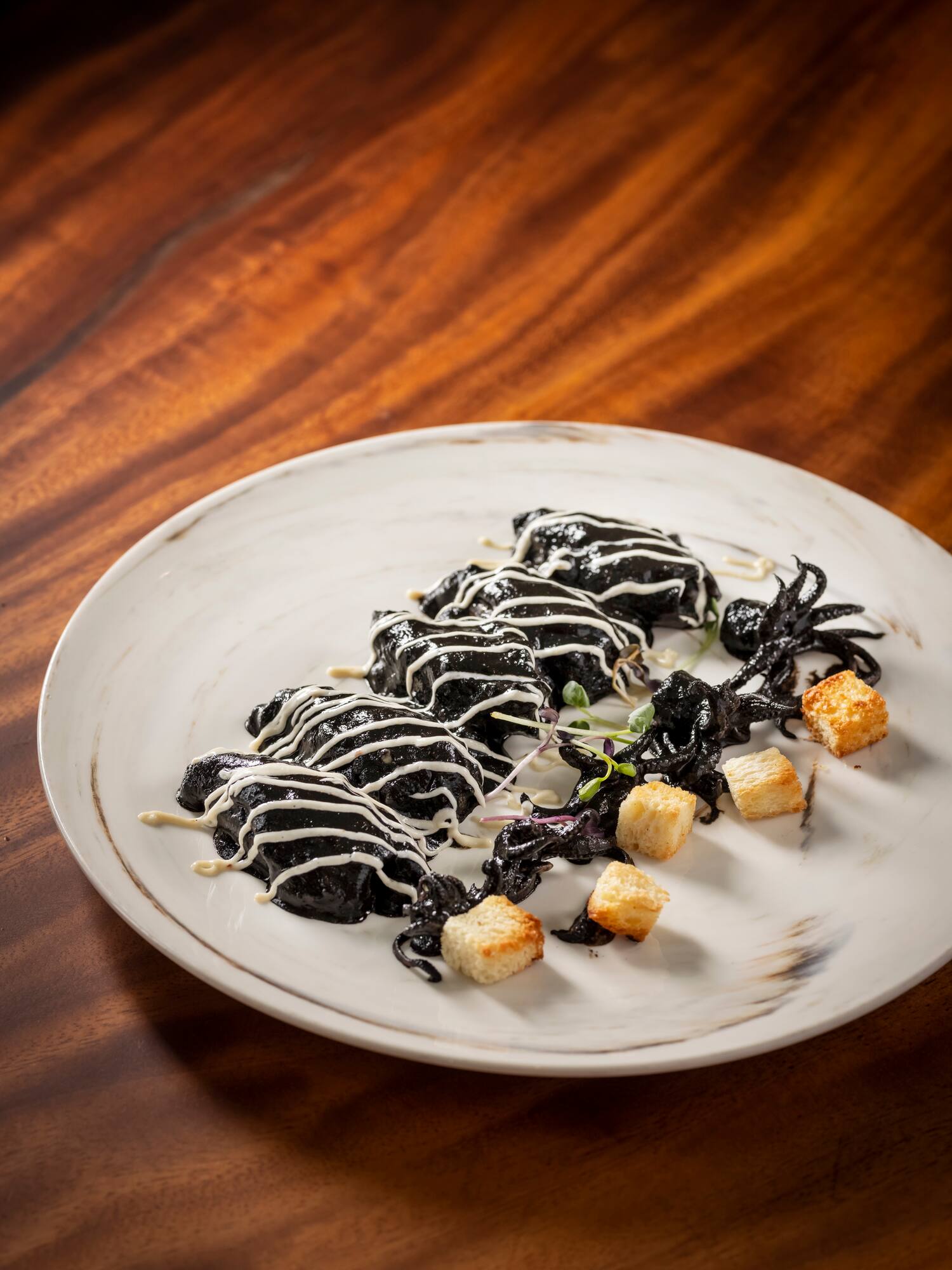 a plate of food on a wood table