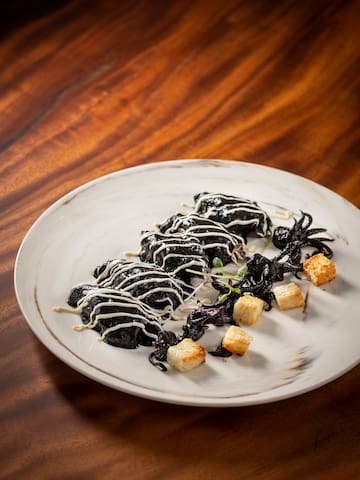 a plate of food on a wood table