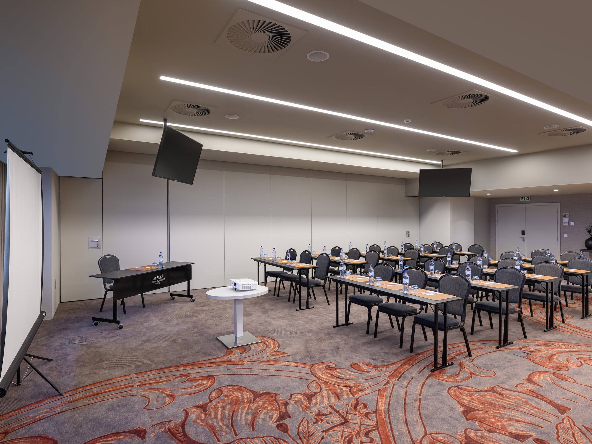 a room with tables and chairs