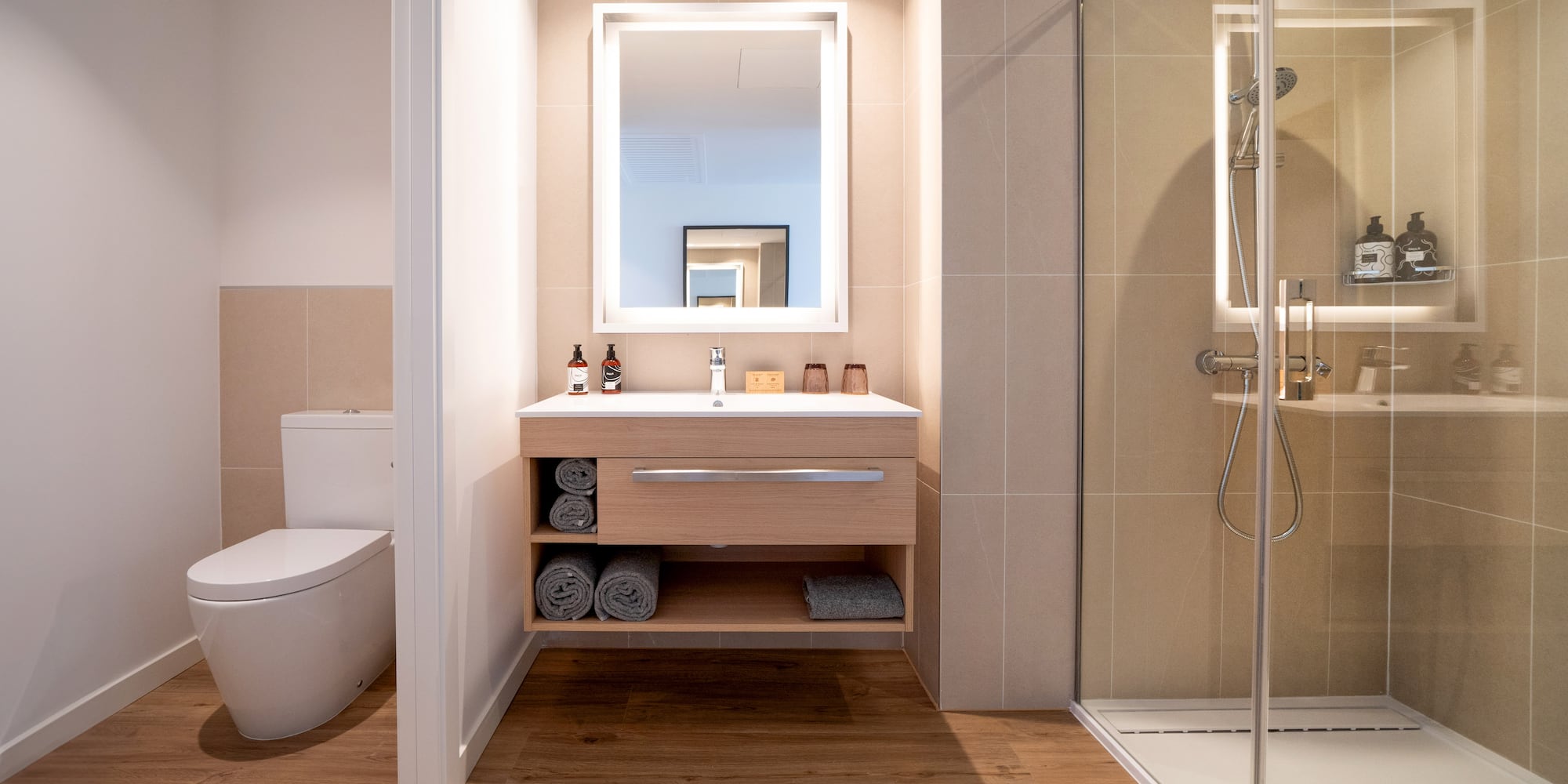 a bathroom with a mirror and a toilet