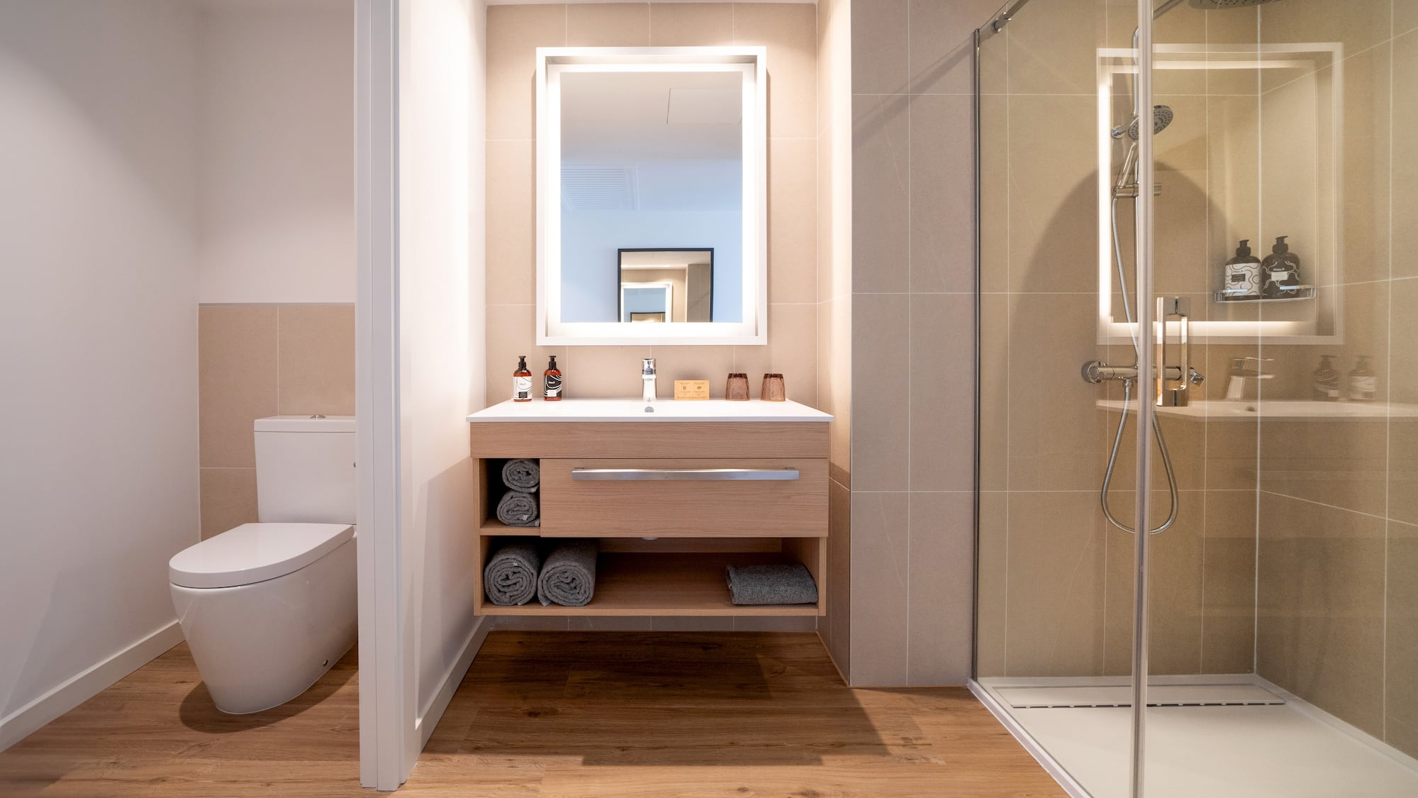 a bathroom with a mirror and a toilet