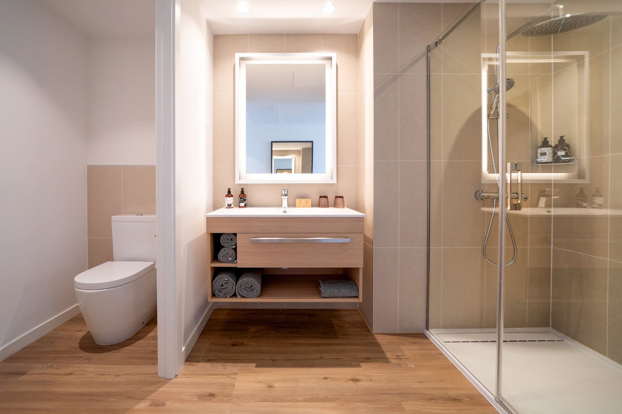 a bathroom with a mirror and a toilet