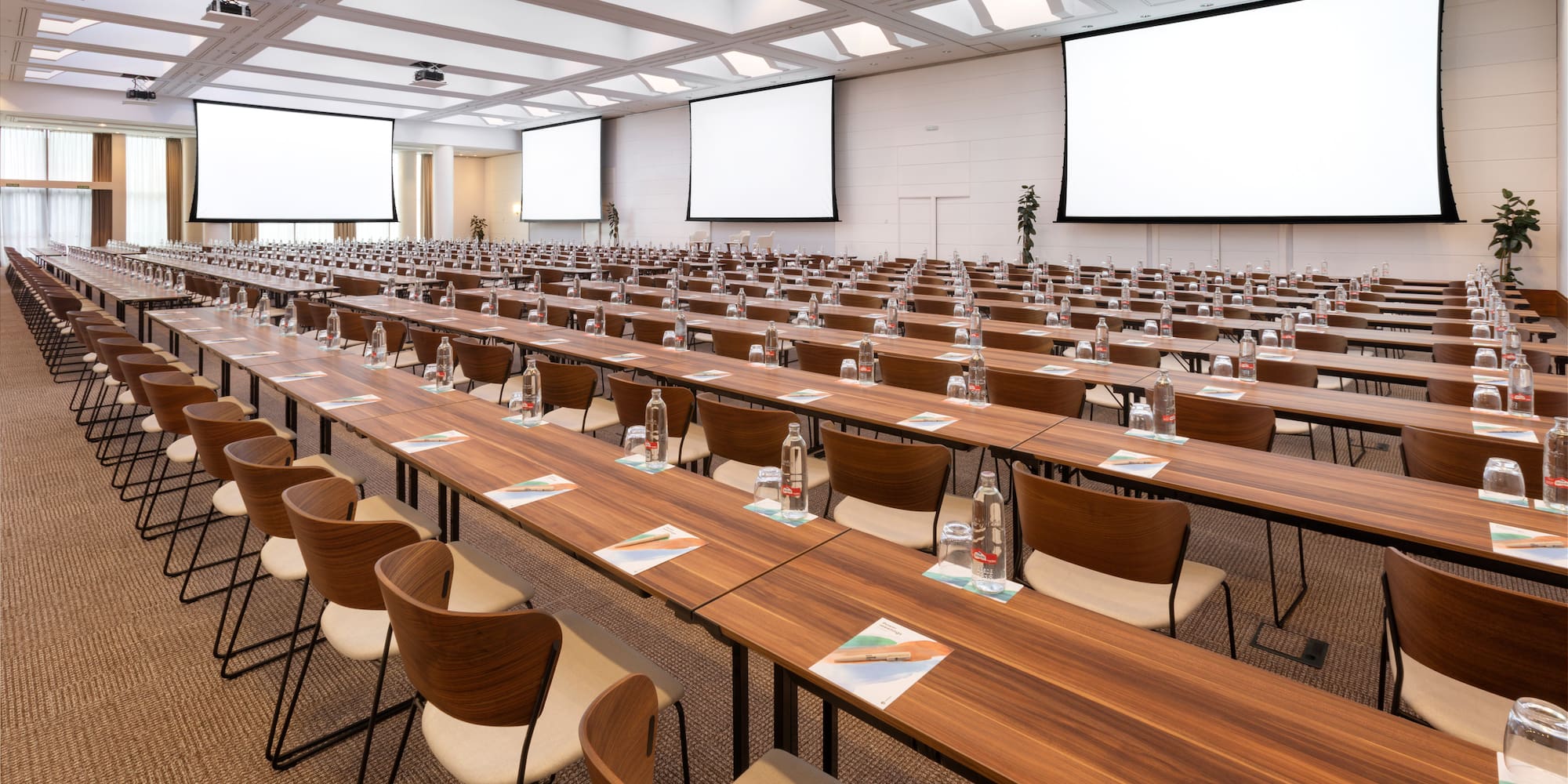 a large conference room with tables and chairs