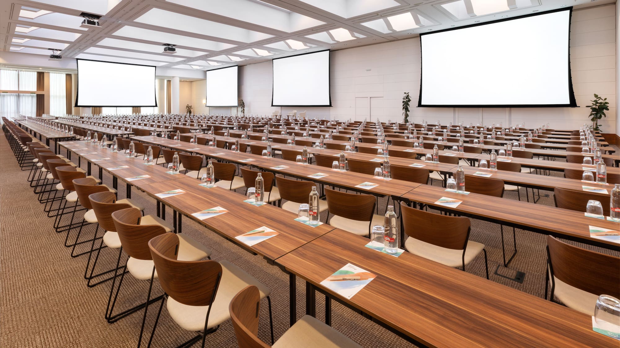 a large conference room with tables and chairs