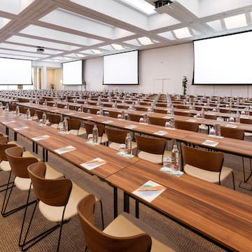a large conference room with tables and chairs