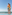 Couple embracing by resort infinity pool with ocean view and sandy beach.