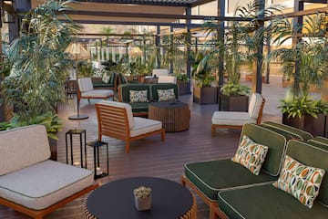 a patio with chairs and tables