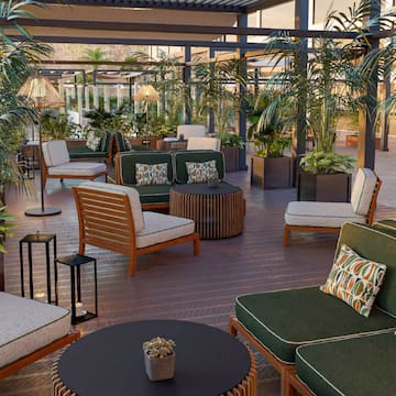 a patio with chairs and tables