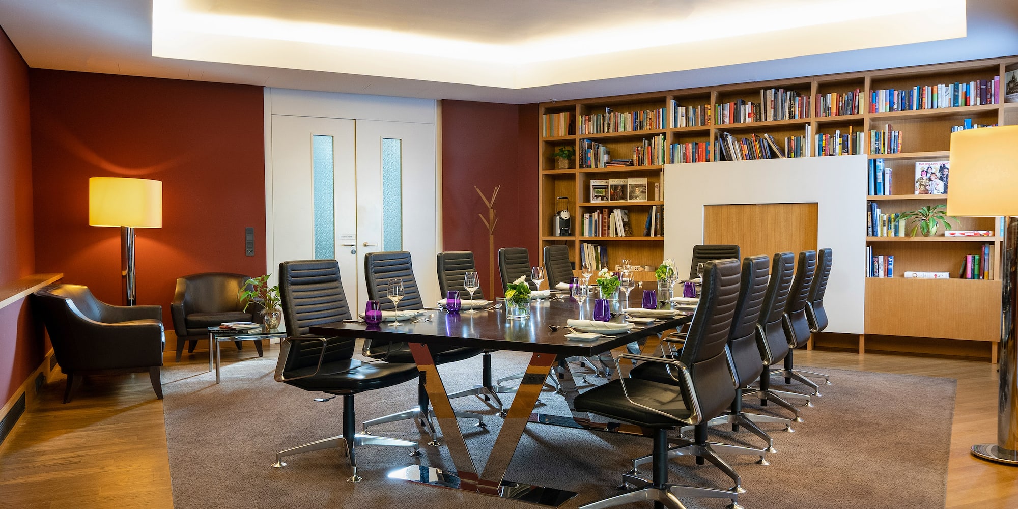 a conference room with a table and chairs