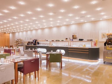 a room with a counter and tables