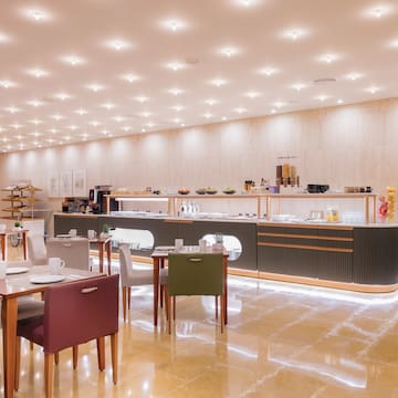 a room with a counter and tables