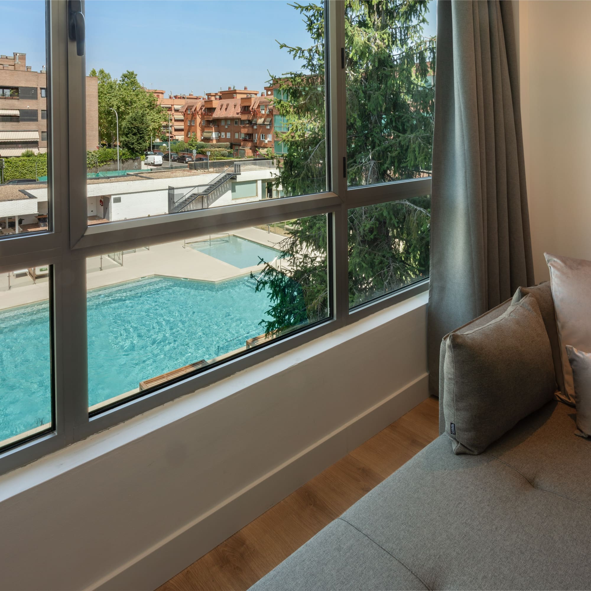 a couch next to a window