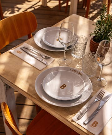 a table with plates and glasses