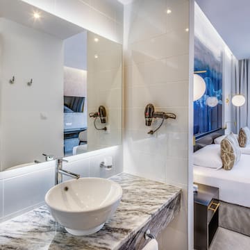 a bathroom with a sink and mirror