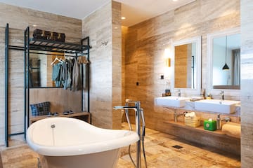 a bathroom with a tub and sink